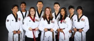 Owners, Instructors and top Taekwondo students smiling for picture in Mill Creek
