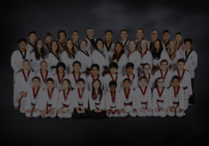 Class of Taekwondo students sitting for picture in Mill Creek